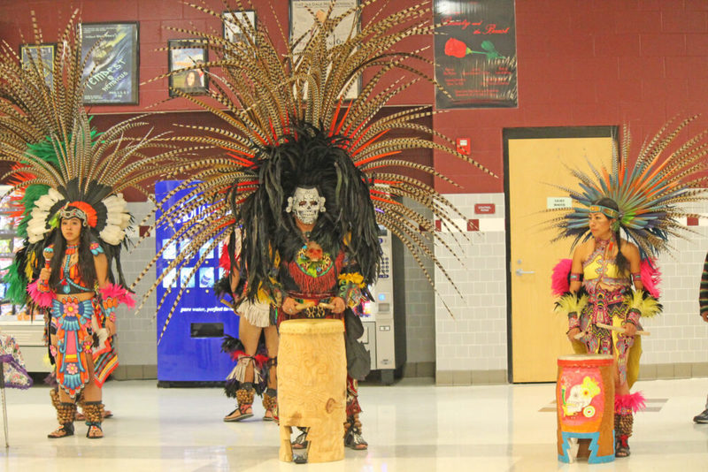 Performers in traditional aztec outfits