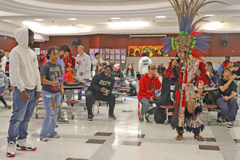 Students watching aztec performers