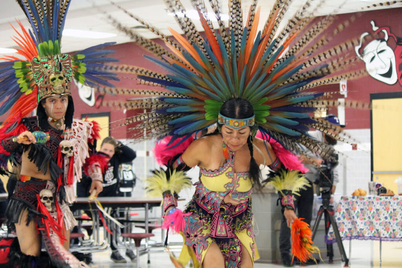 Traditional aztec dancers in colorful plumage