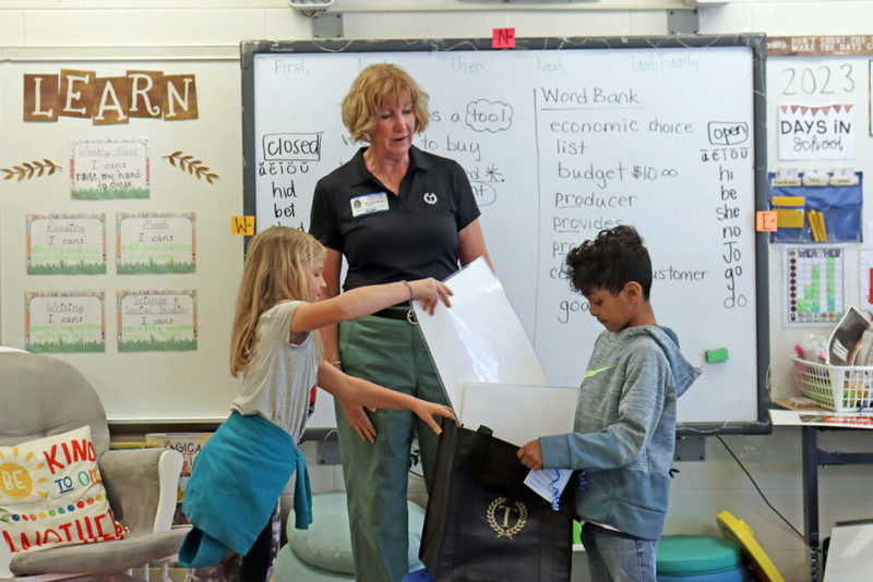 Teacher with students doing an activity