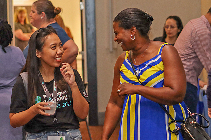 Two women smiling and talking